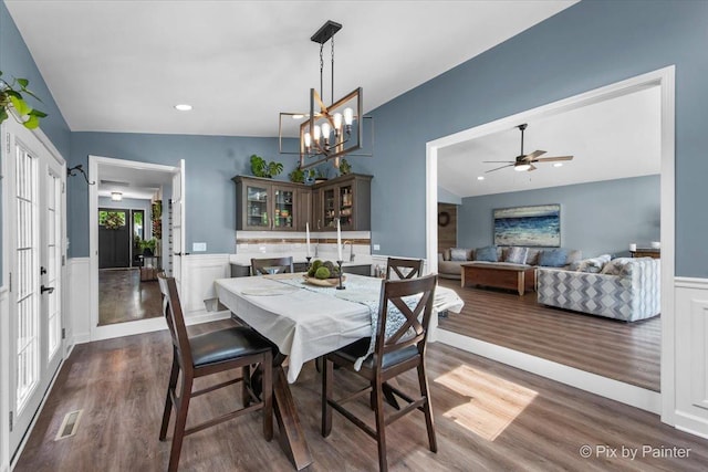 6561 Dunham Rd, Downers Grove, IL 60515 - dining room featuring wood finished floors, a wainscoted wall, lofted ceiling, a chandelier, and ceiling fan