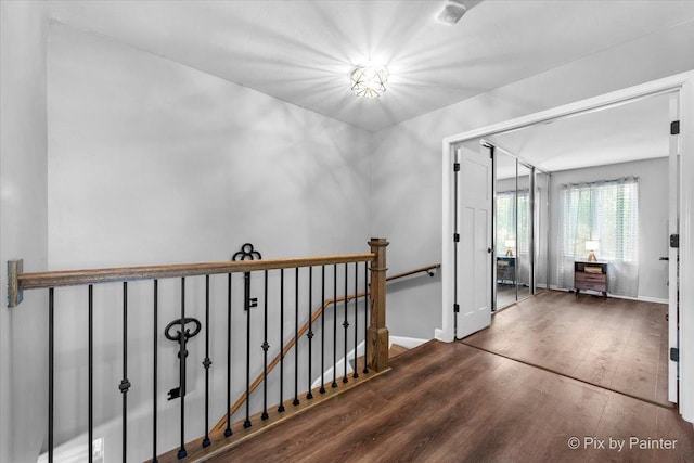 6561 Dunham Rd, Downers Grove, IL 60515 - corridor featuring an upstairs landing, wood finished floors, and baseboards