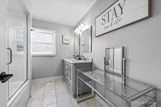 6561 Dunham Rd, Downers Grove, IL 60515 - bathroom with vanity, baseboards, marble finish flooring, and enclosed tub / shower combo
