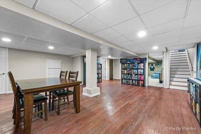 6561 Dunham Rd, Downers Grove, IL 60515 - dining space featuring a paneled ceiling, stairs, wood finished floors, and recessed lighting