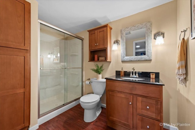 6561 Dunham Rd, Downers Grove, IL 60515 - bathroom with wood finished floors, toilet, vanity, and a shower stall