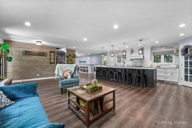 6561 Dunham Rd, Downers Grove, IL 60515 - living area featuring wooden walls, recessed lighting, dark wood-type flooring, and baseboards