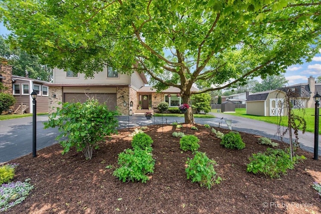 6561 Dunham Rd, Downers Grove, IL 60515 - view of front of house featuring a garage, driveway, and brick siding