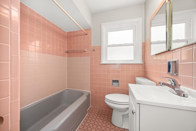 full bathroom featuring a healthy amount of sunlight, tile walls, tile patterned floors, and toilet