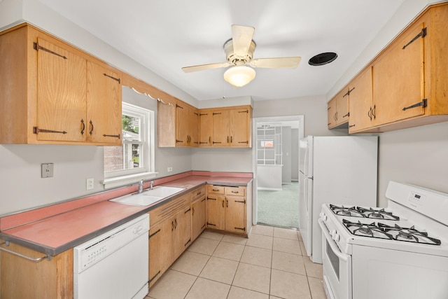 kitchen featuring white appliances, light tile patterned flooring, ceiling fan, and a sink