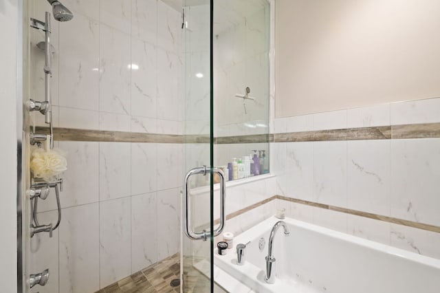 2424 W Chicago Ave Unit 203, Chicago, IL 60622 - bathroom featuring a garden tub, a stall shower, and tile walls