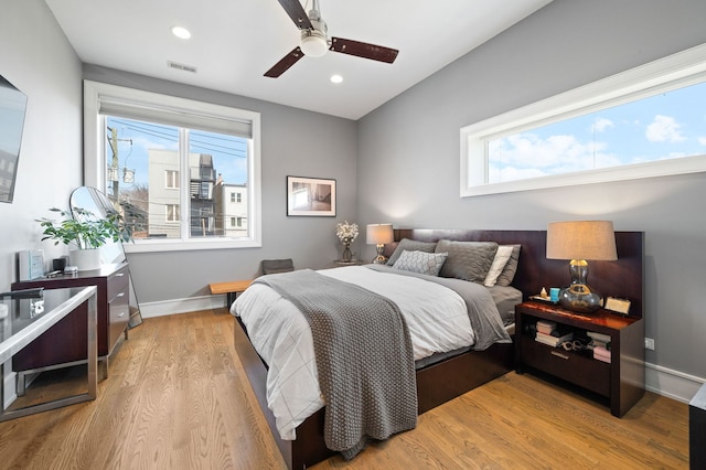 2424 W Chicago Ave Unit 203, Chicago, IL 60622 - bedroom featuring baseboards, visible vents, multiple windows, and light wood-style flooring