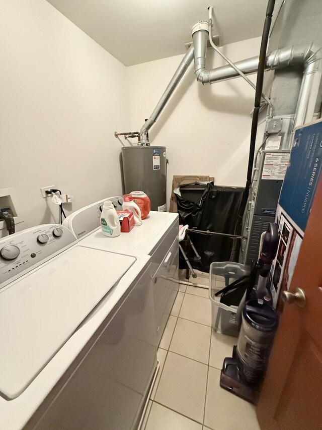 353 S Whispering Hills Dr Unit C, Naperville, IL 60540 - washroom with laundry area, washer and clothes dryer, water heater, and light tile patterned flooring