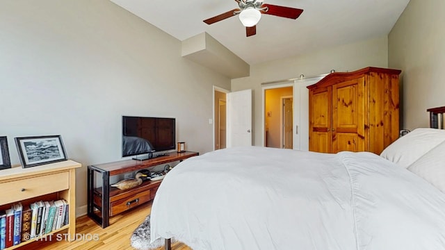 bedroom with light wood finished floors and ceiling fan