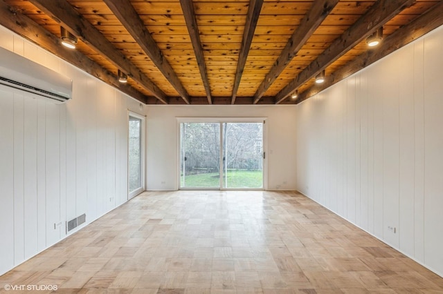 unfurnished room featuring beam ceiling, wood walls, a wall unit AC, visible vents, and wood ceiling