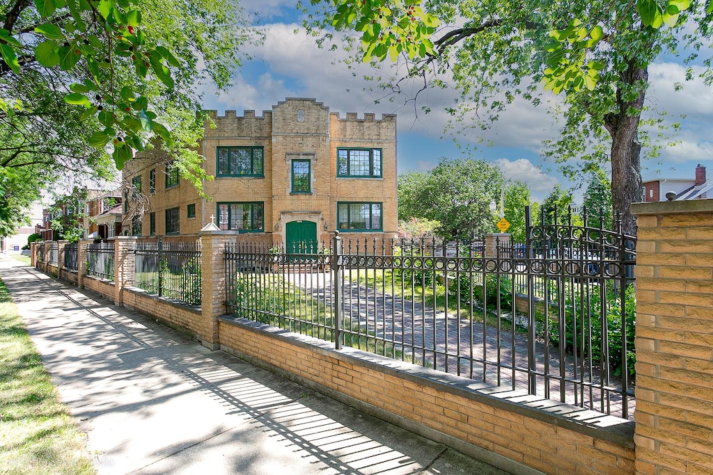 view of gate featuring a fenced front yard