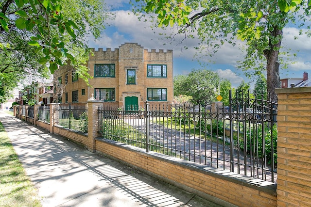 view of gate featuring a fenced front yard