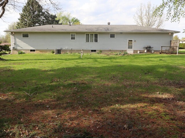 1605 Sharon Rd, Streator, IL 61364 - back of house featuring central AC unit and a yard