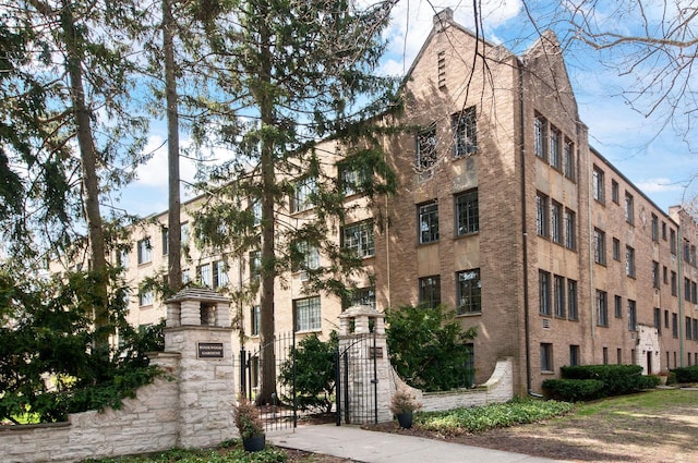 view of building exterior with fence