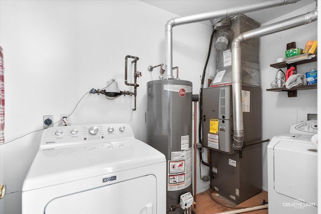 laundry area with independent washer and dryer, laundry area, and gas water heater