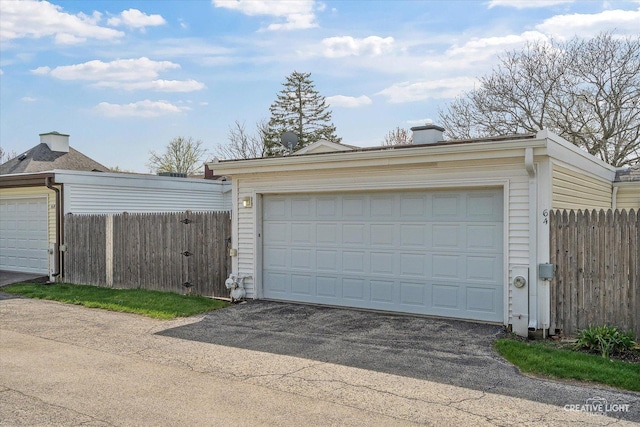 garage with fence