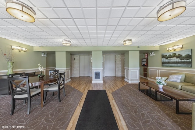 5400 Walnut Ave Unit 214, Downers Grove, IL 60515 - dining space featuring wainscoting and wood finished floors