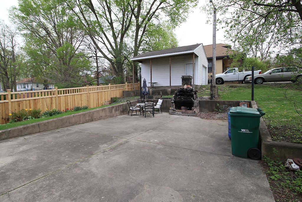view of patio / terrace featuring fence