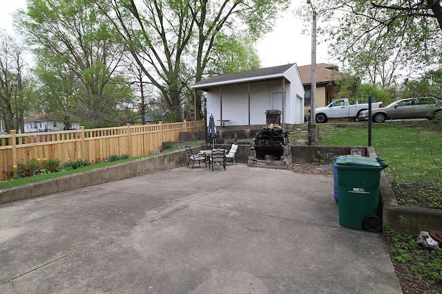 view of patio / terrace featuring fence