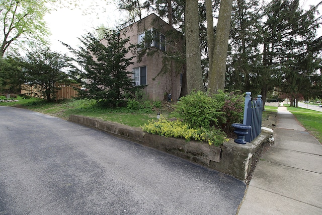 view of side of home with fence