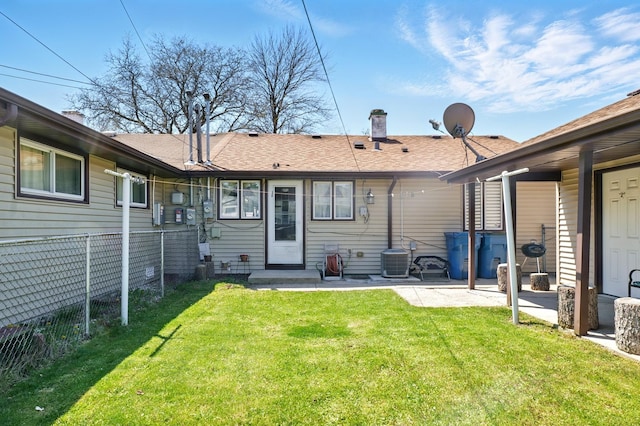8801 S Kilbourn Ave, Hometown, IL 60456 - rear view of house with fence, cooling unit, a patio, a chimney, and a lawn