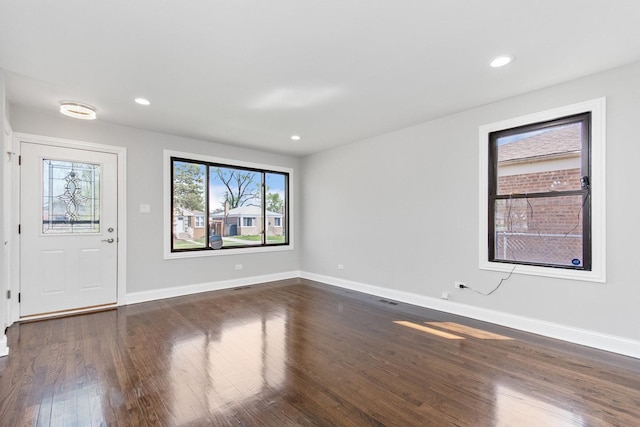 foyer featuring recessed lighting, baseboards, and dark wood finished floors