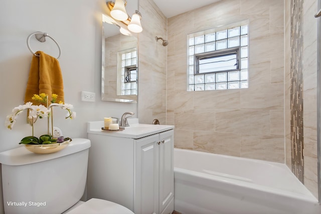 full bathroom featuring shower / bath combination, vanity, toilet, and a wealth of natural light