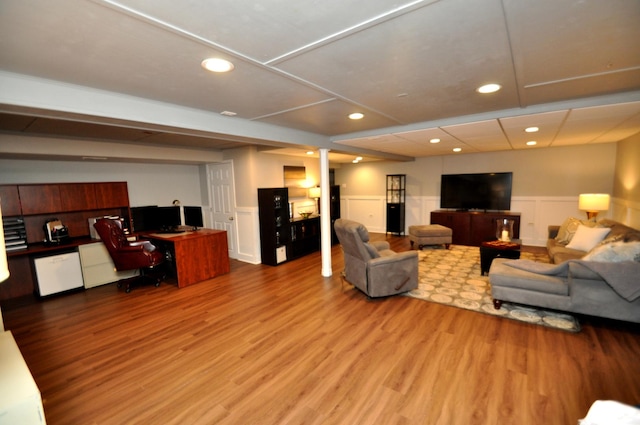 living room featuring wainscoting, recessed lighting, and wood finished floors