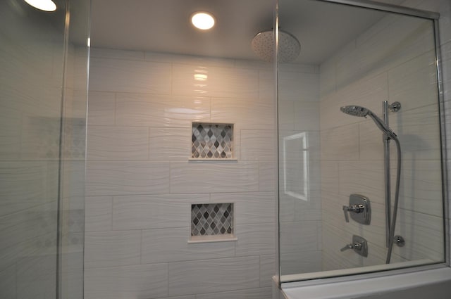 full bath featuring a tile shower