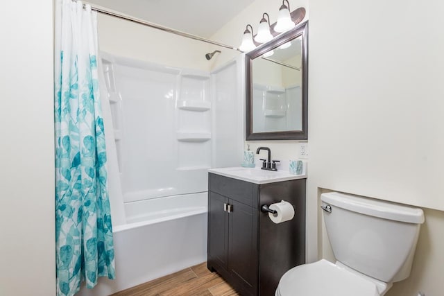 full bath with vanity, toilet, wood finished floors, and shower / bath combo with shower curtain