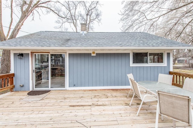 wooden deck with outdoor dining space