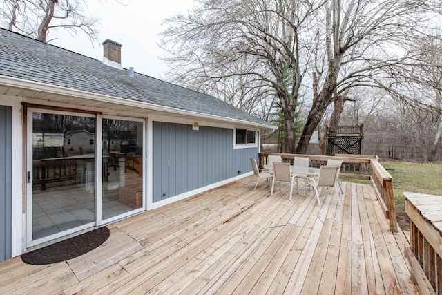 wooden terrace featuring outdoor dining space
