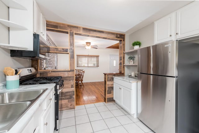kitchen featuring ceiling fan, open shelves, stainless steel appliances, and white cabinetry
