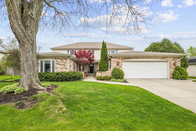 3130 Kayjay Dr, Northbrook, IL 60062 - prairie-style home with concrete driveway, brick siding, a garage, and a front lawn