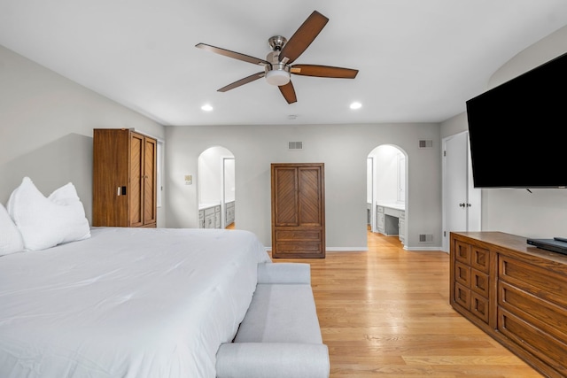3130 Kayjay Dr, Northbrook, IL 60062 - bedroom featuring arched walkways, light wood finished floors, recessed lighting, and visible vents