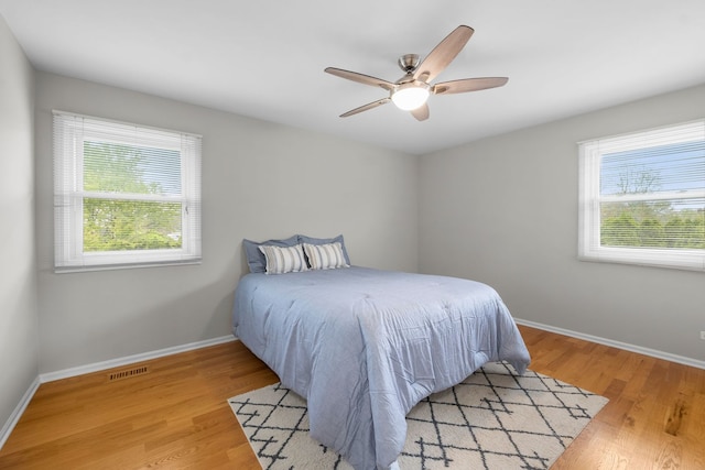 3130 Kayjay Dr, Northbrook, IL 60062 - bedroom with baseboards, multiple windows, and light wood-style flooring