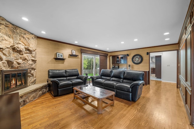 3130 Kayjay Dr, Northbrook, IL 60062 - living room with light wood-type flooring, ornamental molding, a stone fireplace, and recessed lighting