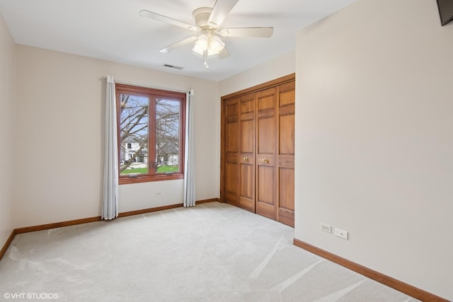 354 Gateshead Dr, Naperville, IL 60565 - unfurnished bedroom with visible vents, baseboards, ceiling fan, and light carpet