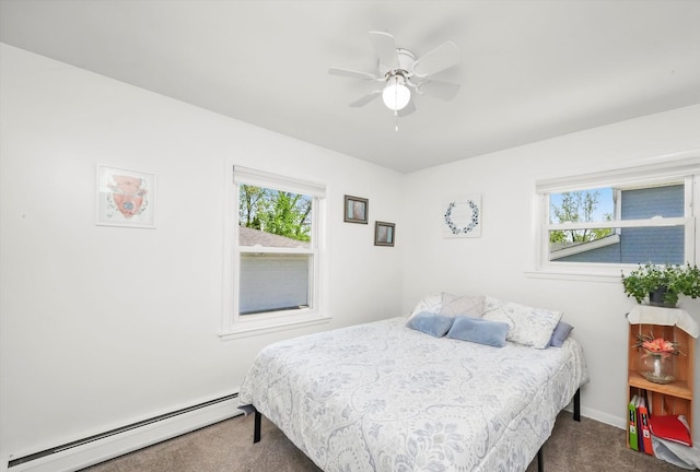 bedroom featuring a baseboard radiator, carpet floors, multiple windows, and baseboards