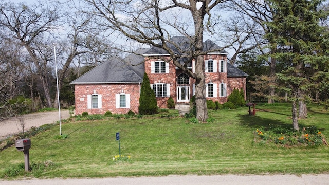 3664 E 2619th Rd, Sheridan, IL 60551 - colonial inspired home featuring brick siding, a front lawn, and roof with shingles