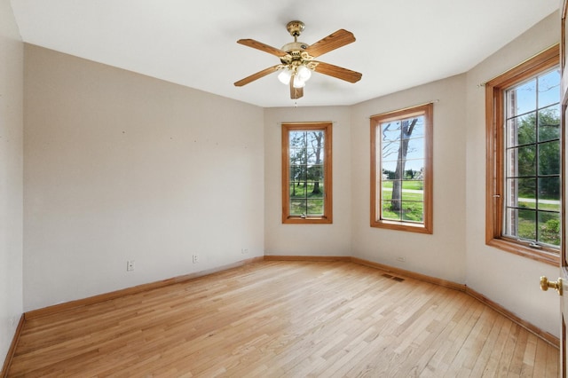 3664 E 2619th Rd, Sheridan, IL 60551 - empty room with plenty of natural light, light wood-style floors, baseboards, and ceiling fan