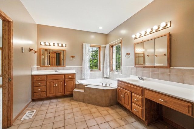 3664 E 2619th Rd, Sheridan, IL 60551 - bathroom featuring two vanities, a bath, and tile patterned floors