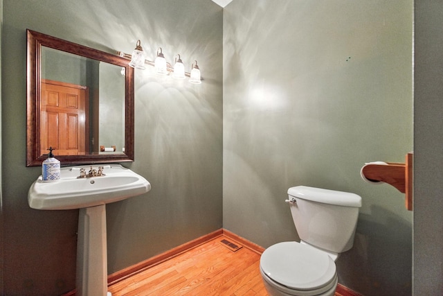 3664 E 2619th Rd, Sheridan, IL 60551 - bathroom with wood finished floors, toilet, and baseboards