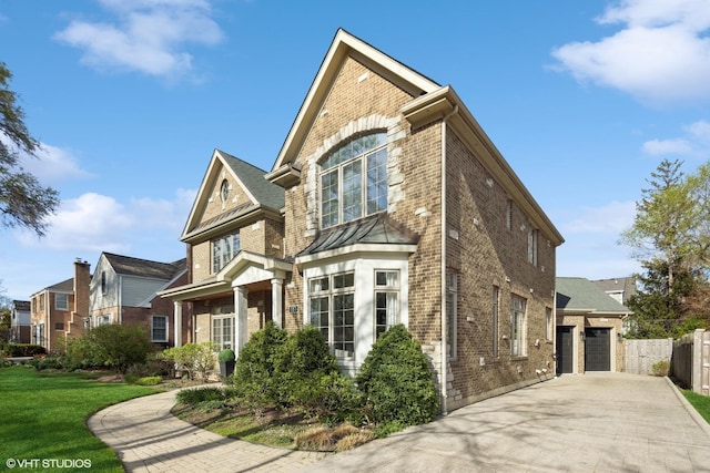 117 Iroquois Dr, Clarendon Hills, IL 60514 - traditional home featuring brick siding, concrete driveway, and a garage