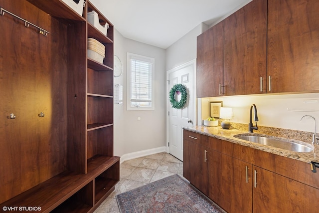 117 Iroquois Dr, Clarendon Hills, IL 60514 - mudroom with a sink, baseboards, and light tile patterned flooring