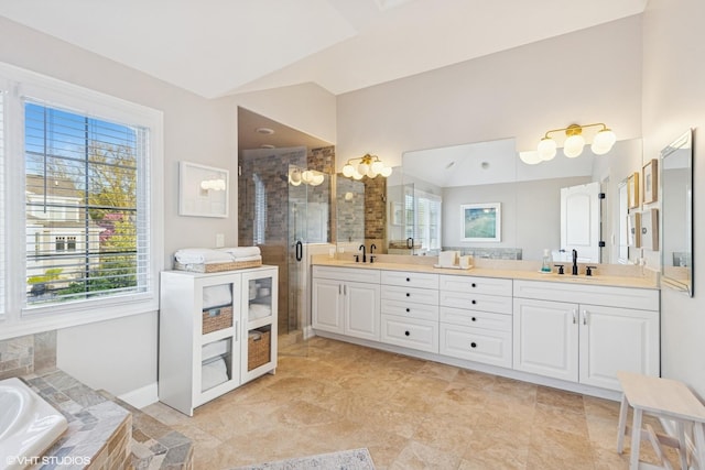 117 Iroquois Dr, Clarendon Hills, IL 60514 - full bath with plenty of natural light, lofted ceiling, double vanity, a stall shower, and a bath