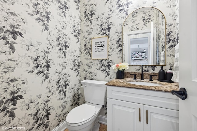 117 Iroquois Dr, Clarendon Hills, IL 60514 - bathroom with wallpapered walls, vanity, and toilet
