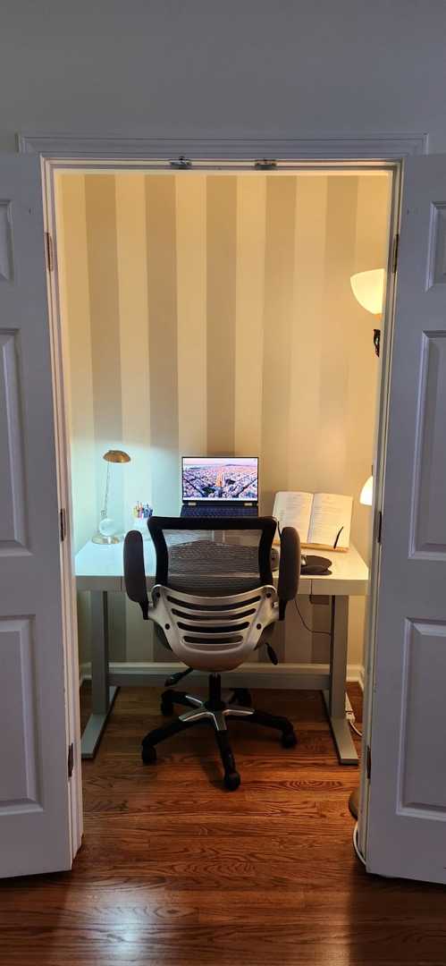 office space featuring baseboards and dark wood-style flooring