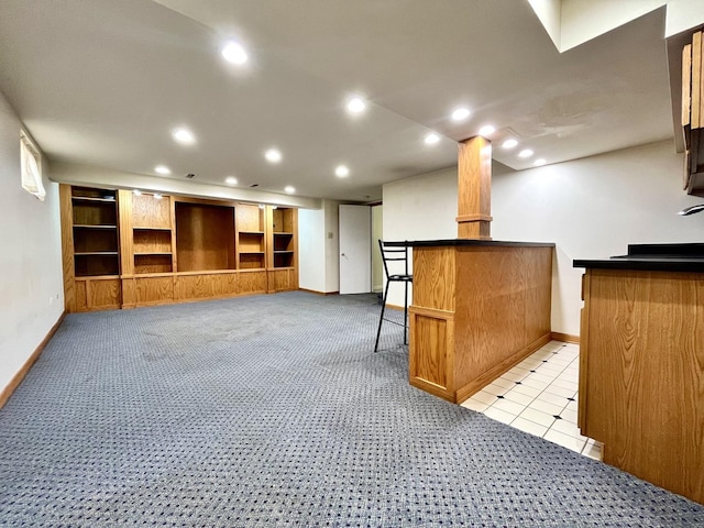 interior space with baseboards, indoor bar, recessed lighting, and light colored carpet