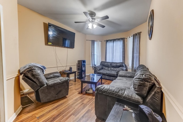 6601 S St Lawrence Ave, Chicago, IL 60637 - living area featuring light wood finished floors, ceiling fan, and baseboards